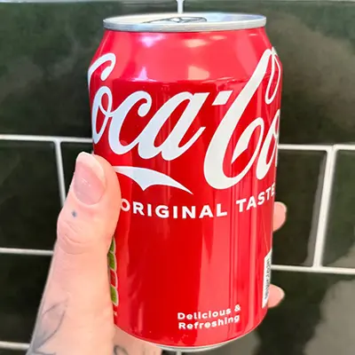 A can of coca cola in a hand