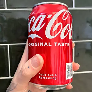 A can of coca cola in a hand